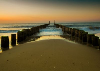 Wandbild Alu Dibond: Zeeland Strand im Sonnenuntergang.